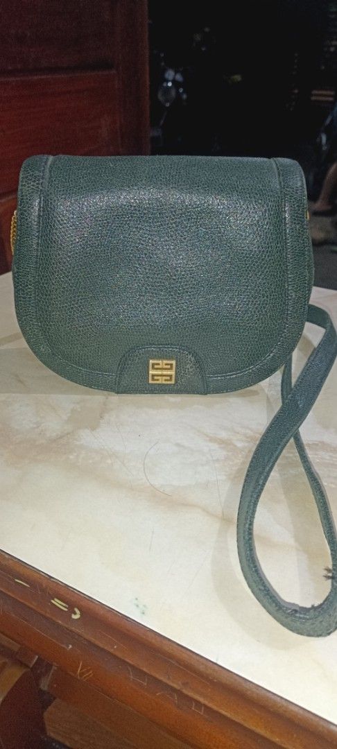 Givenchy Green Crossbody Bag (Category: Luxury Bags & Wallets) located in Quezon City. Submitted by ir0412 (Listing ID 1421567251, Image 1). Description: - Green Givenchy crossbody bag - Flap closure with gold-tone logo - Adjustable long strap - Light brown interior lining - Gold-tone chain detail - Made of a textured material -authentic money-back guarantee.