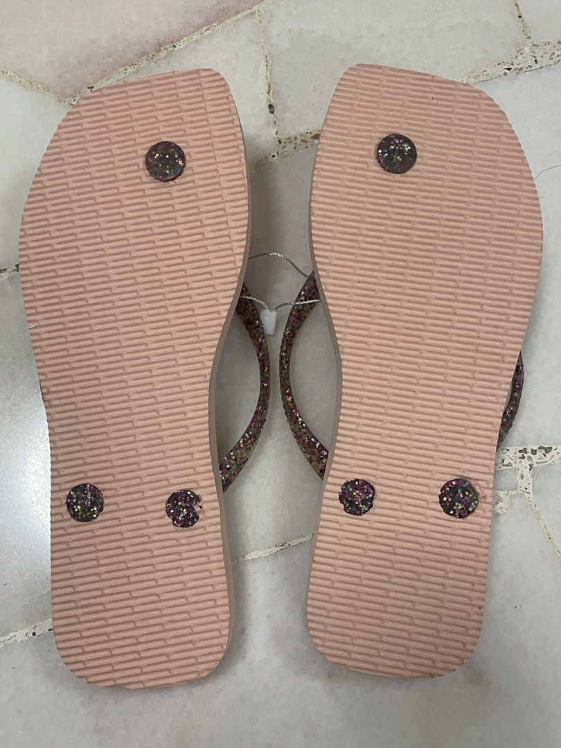 Havaianas Pink Slim Square Glitter Metallic Logo Flip-Flops - Size 35/36 (Category: Flipflops and Slides) located in Singapore. Submitted by midnite_skye (Listing ID 1421580942, Image 2). Description: - Brand new Havaianas flip-flops - Size: 35/36 (EUR) - Features glitter straps - Never worn, with original tags - Perfect for beach or casual wear - Comfortable and stylish.