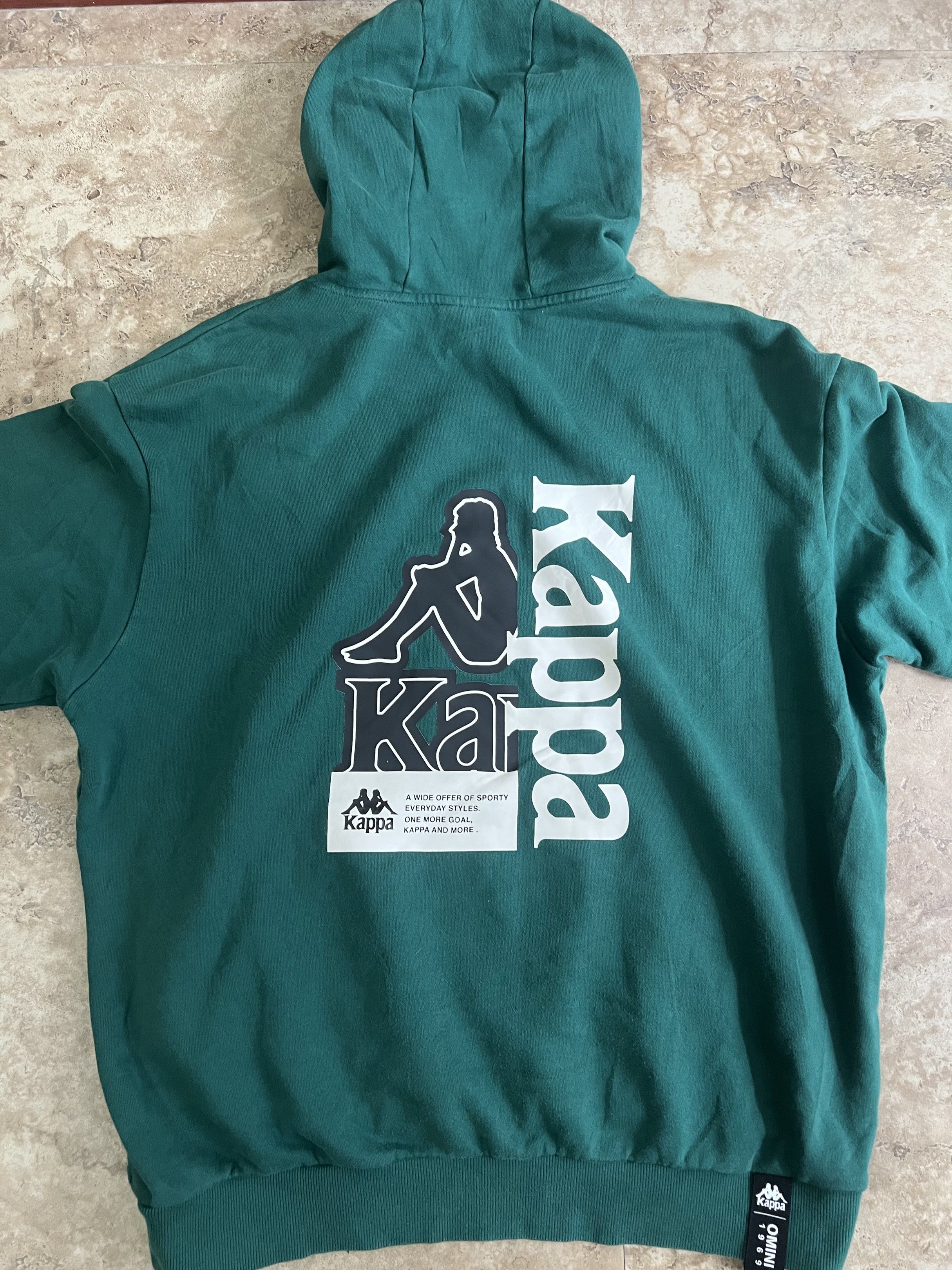 Kappa Green Hoodie XL (Category: Hoodies) located in Manila. Submitted by naze0729 (Listing ID 1421496824, Image 3). Description: - 24 W - 27 L - Good Condition - Color Rate 9.8/10 - Green Kappa hoodie - XL size - Kappa logo on front and back - Made in China - Material: Cotton and spandex blend - Front pocket.