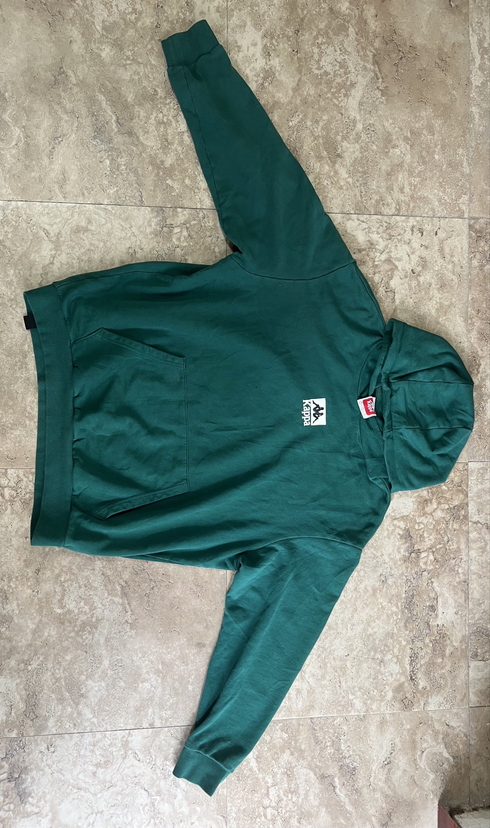 Kappa Green Hoodie XL (Category: Hoodies) located in Manila. Submitted by naze0729 (Listing ID 1421496824, Image 1). Description: - 24 W - 27 L - Good Condition - Color Rate 9.8/10 - Green Kappa hoodie - XL size - Kappa logo on front and back - Made in China - Material: Cotton and spandex blend - Front pocket.
