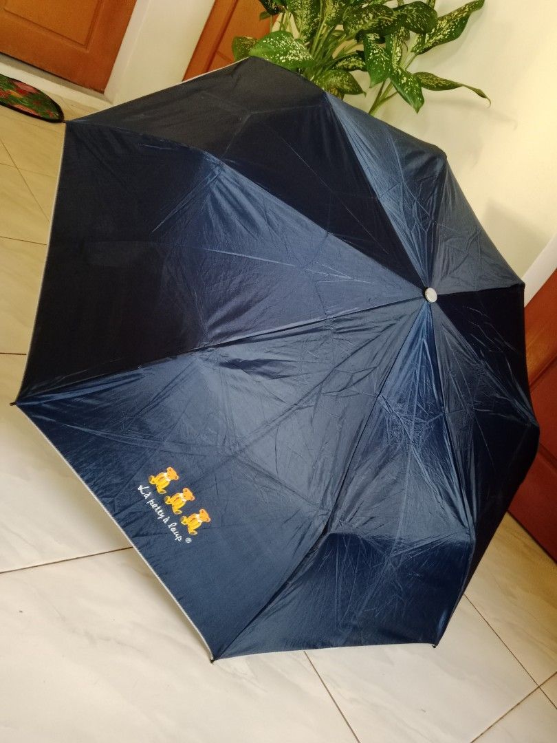 La petty a loup Umbrella (Category: Umbrellas) located in Polangui. Submitted by cornerbags_shoes (Listing ID 1421548514, Image 1). Description: Japan surplus - Navy blue La petty a loup umbrella - Features a cute teddy bear design - Silver interior - Black handle - Folds up compactly - Perfect for rainy days - Stylish and functional - not automatic.