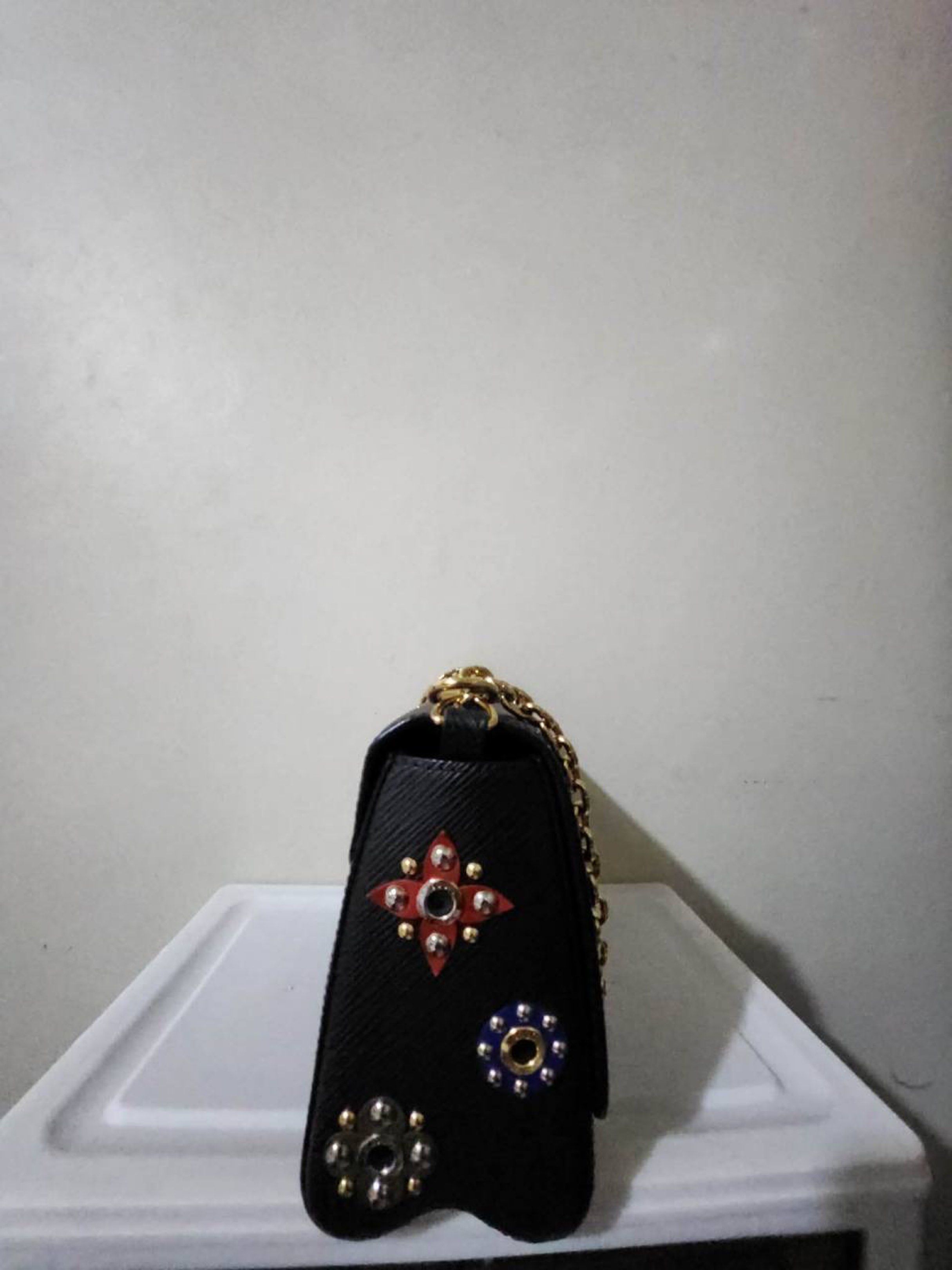 Louis Vuitton Twist MM Chain Bag (Category: Luxury Bags & Wallets) located in Quezon City. Submitted by preloved4ever_ (Listing ID 1421462642, Image 3). Description: - Authentic Louis Vuitton Twist chain bag - Black textured leather exterior - Gold-tone hardware - Chain strap - Iconic LV twist lock closure - Compact size, perfect for essentials Condition: 9/10 Rfs: downsizing collection Slighty negotiable.