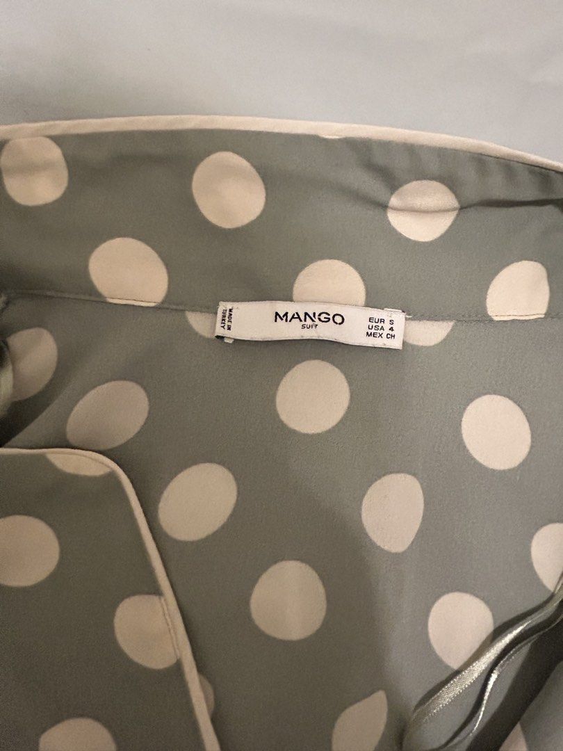 Mango Polka Dot Blouse (Category: Blouses) located in Quezon City. Submitted by bea30 (Listing ID 1421589077, Image 3). Description: - Mango blouse - Polka dot pattern - Soft color palette - Long sleeves - Buttoned cuffs - Collared neckline - Button-down front - Lightweight fabric - No issues, used only once.