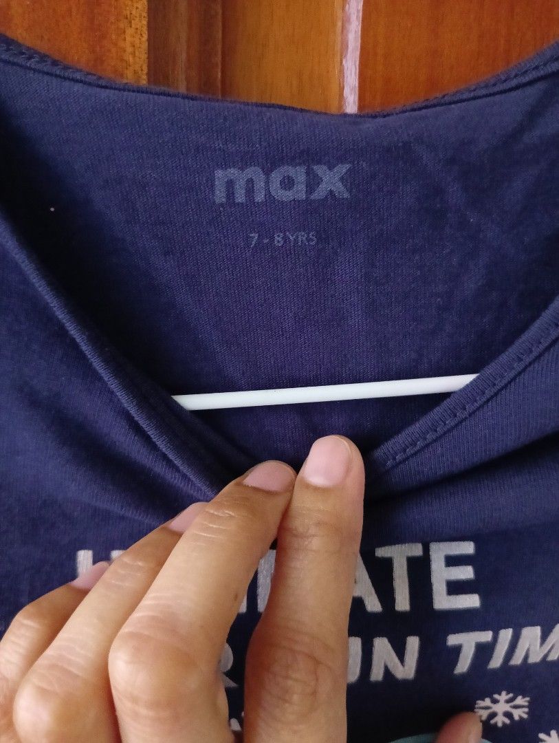 Max Ultimate Winter Fun Time Long Sleeve Shirt (Category: Babies & Kids Fashion) located in Santa Rosa. Submitted by amiraamara (Listing ID 1421523773, Image 3). Description: - Max navy blue long sleeve shirt - Size: 7-8 years - Design: "Ultimate Winter Fun Time" graphic with emojis - Features: Ruffle shoulder details - Back: Plain navy blue.