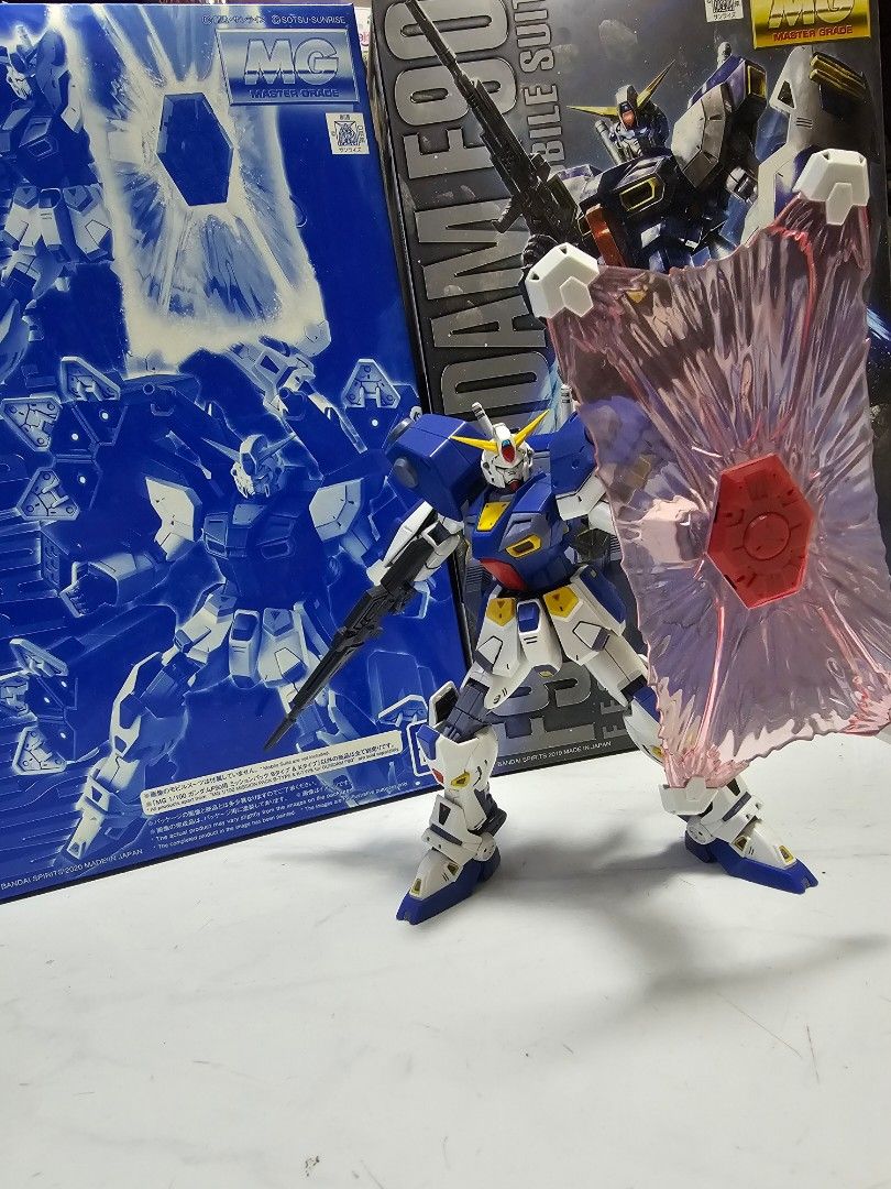 MG F90 Gundam & Mission Pack K Type, with unbuilt B Type (Category: Gundam Model Kits) located in Singapore. Submitted by z_exia (Listing ID 1421533629, Image 2). Description: MG F90 Gundam with mission pack B type and K type. Built and panel lined with stickers applied, comes with all original accessories and decals. Mission pack B type still unbuilt..