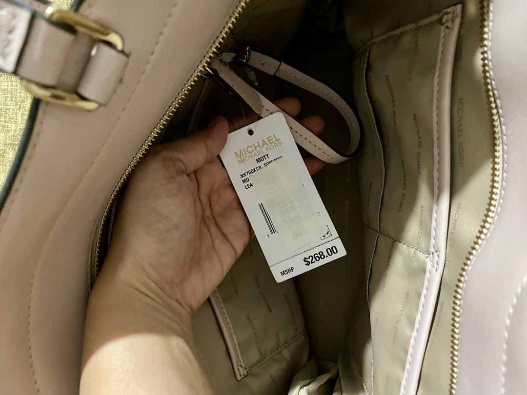 Michael Kors Mott Leather Tote Bag (Category: Luxury Bags & Wallets) located in Makati City. Submitted by eighto8_ (Listing ID 1421605459, Image 3). Description: 💯 Authentic Michael Kors Tote Bag - Bought from U.S Issue: - There are some scratches, peeling and discoloration. Please see photos for reference..