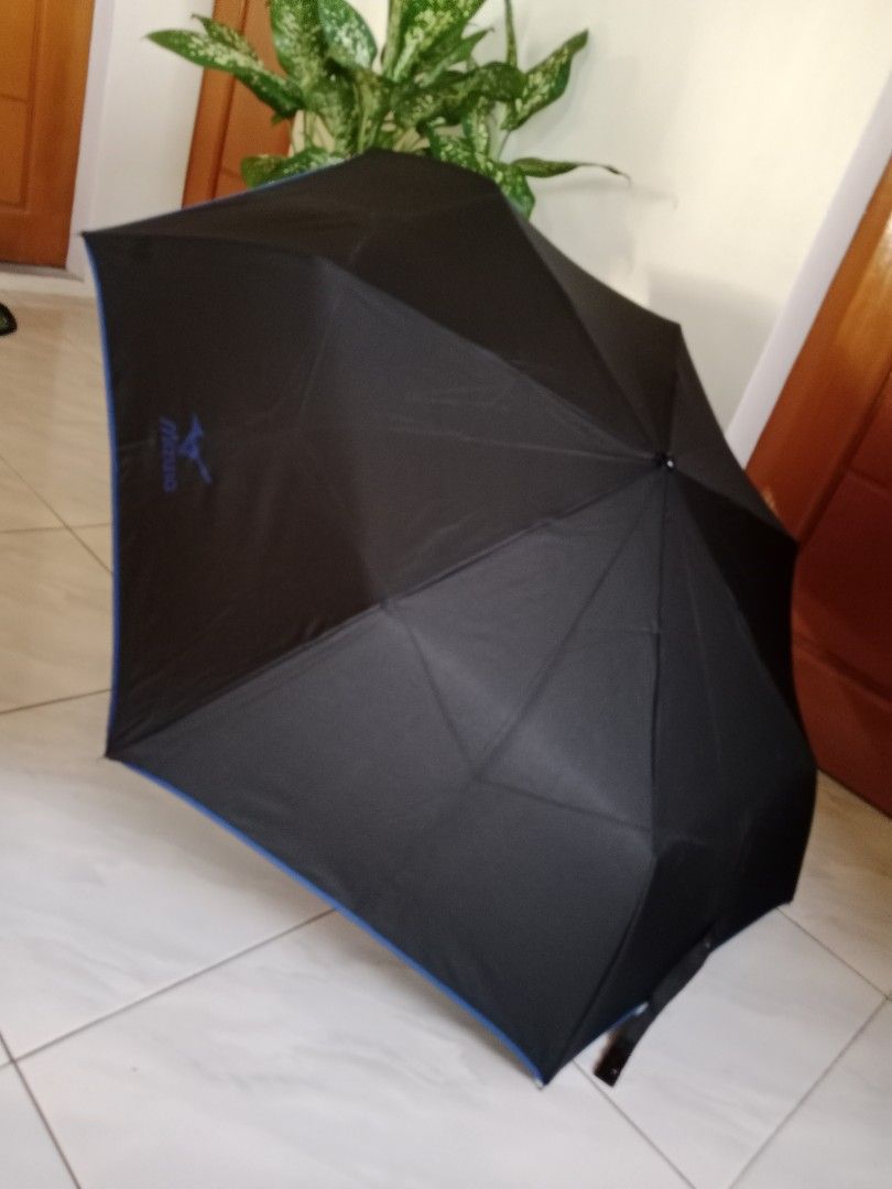 Mizuno Black Umbrella (Category: Umbrellas) located in Polangui. Submitted by cornerbags_shoes (Listing ID 1421548209, Image 1). Description: Japan surplus - Black Mizuno umbrella - Features blue trim - Mizuno logo visible - Compact folding design - Silver handle - Made in China.