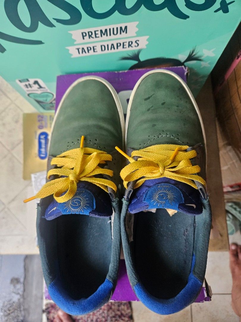 Nike SB Shane Noble Green/Sail (Category: Sneakers) located in Manila. Submitted by bigfish1990 (Listing ID 1421543515, Image 3). Description: - Nike SB Shane - Colorway: Noble Green/Sail-Varsity Red - Size: US 10 / UK 9 / EUR 42 / CM 28.5 - Features: Green, red, and grey color scheme with yellow laces - Includes original box.