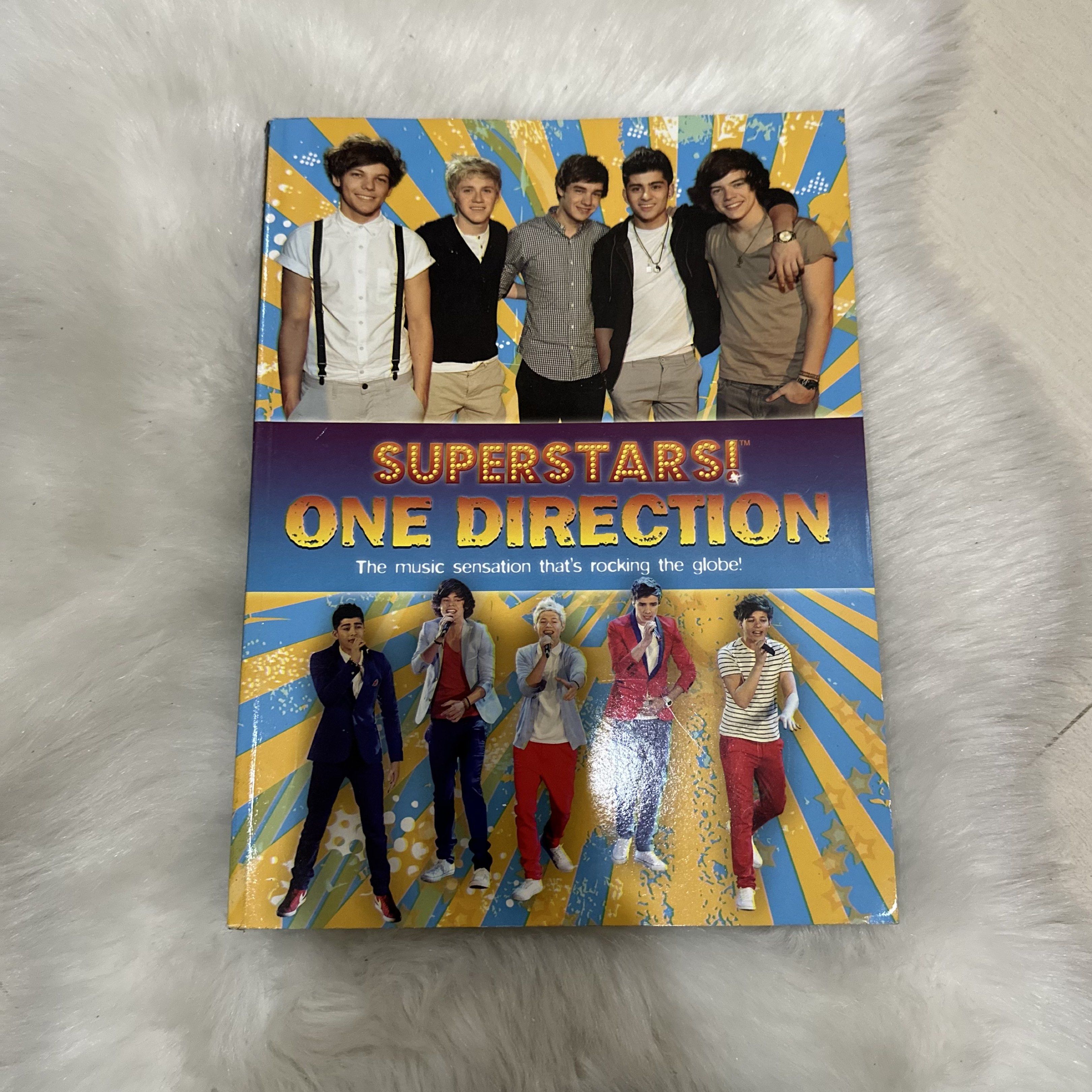One Direction Superstars Soft Bound Book (Category: Magazines) located in Cavite. Submitted by fiarteau (Listing ID 1421490374, Image 1). Description: - One Direction Superstars softbound book. - Features the Fab Five. - Perfect for any One Direction fan. - Relive the memories of the music sensation..