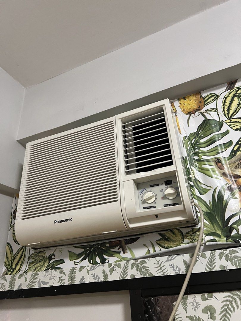 Panasonic Window Type Air Conditioner (Category: Air Conditioning and Heating) located in Manila. Submitted by warmwind.d05007 (Listing ID 1421562032, Image 1). Description: - Panasonic window-type air conditioner - Features control knobs for temperature and main control - White unit - Includes power cord.