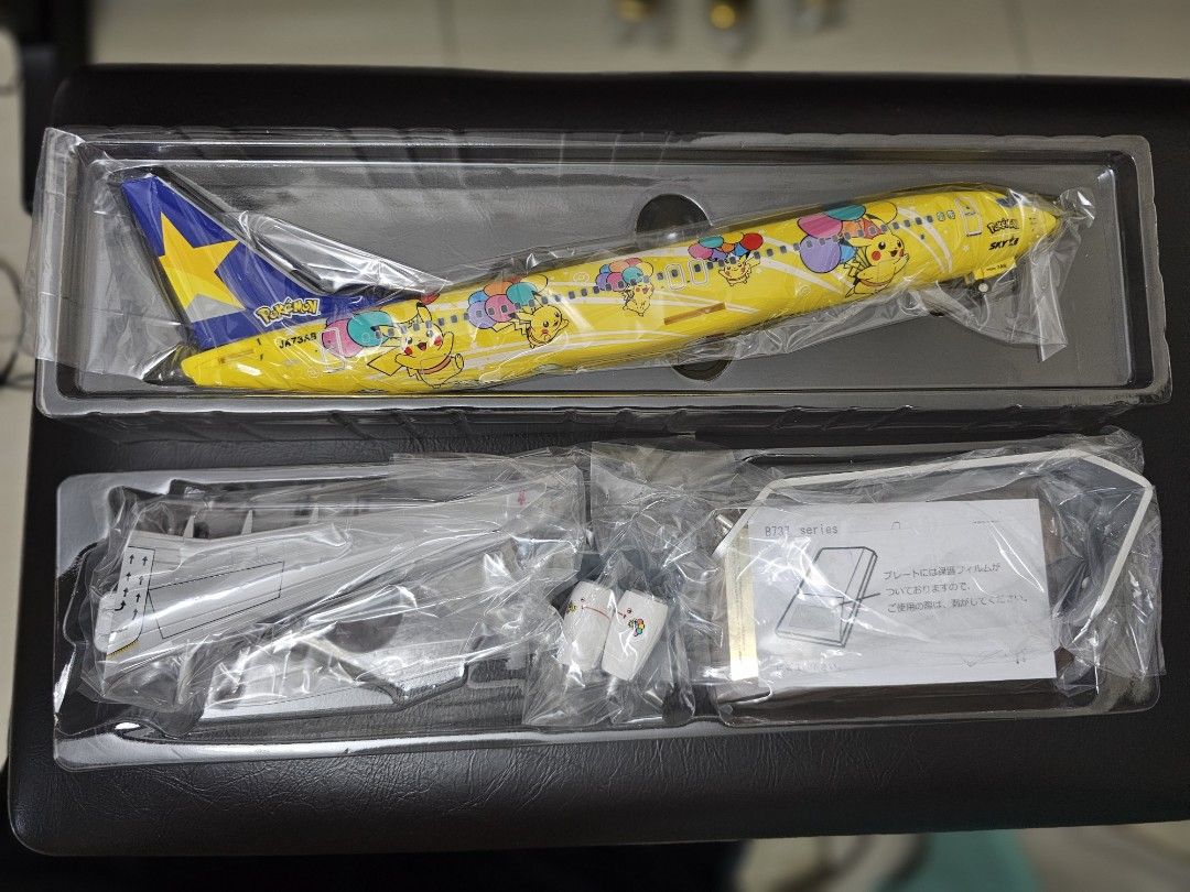 Pikachu Jet BC1 Boeing 737-800 Model Airplane (Category: Vehicle & Diecast Models) located in Manila. Submitted by brightdolphin_229516 (Listing ID 1421569126, Image 3). Description: - Skymark Airlines Pikachu Jet BC1 Boeing 737-800 model. - Scale: 1:130. - Features iconic Pikachu and other Pokemon characters. - Includes airplane model and additional parts. - Perfect for collectors and fans..