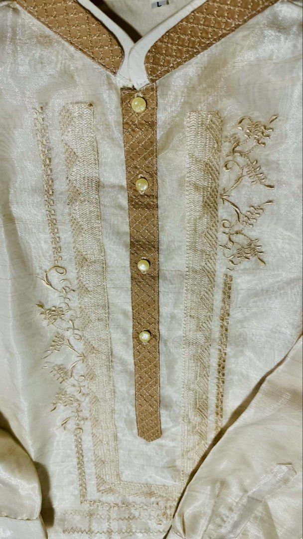 Pinya Barong Tagalog with Embroidery (Category: Formal Shirts) located in Rizal. Submitted by gen_maturan30 (Listing ID 1421594153, Image 2). Description: - Cream-colored Barong Tagalog - Intricate embroidery - Chinese collar - Long sleeves with buttoned cuffs - Decorative front panel with buttons - Subtle sheen fabric - Measurements: 30" length, 23.5" width USED ONCE RFS: Decluttering.