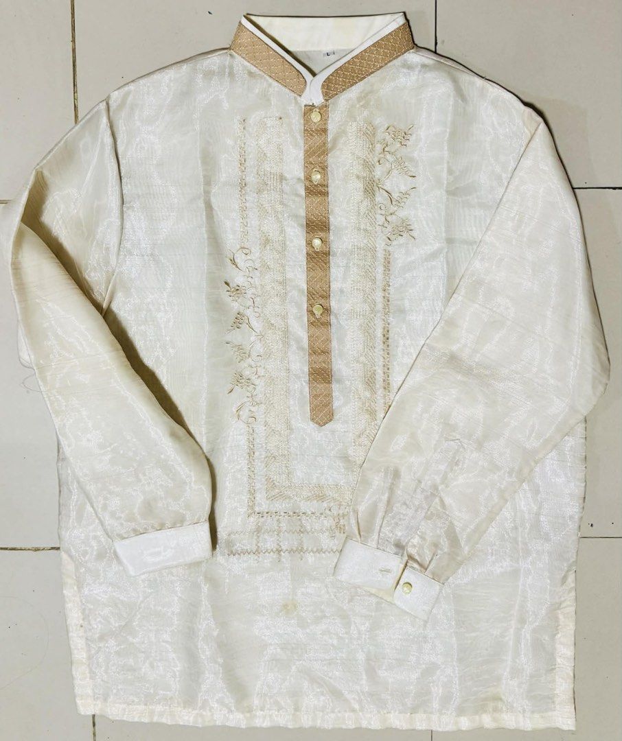 Pinya Barong Tagalog with Embroidery (Category: Formal Shirts) located in Rizal. Submitted by gen_maturan30 (Listing ID 1421594153, Image 1). Description: - Cream-colored Barong Tagalog - Intricate embroidery - Chinese collar - Long sleeves with buttoned cuffs - Decorative front panel with buttons - Subtle sheen fabric - Measurements: 30" length, 23.5" width USED ONCE RFS: Decluttering.