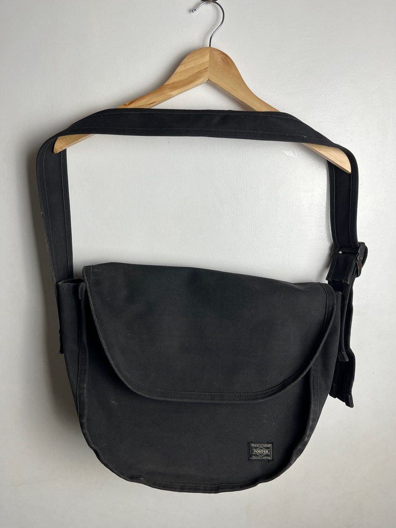 Porter Tokyo Black Messenger Bag (Category: Sling Bags) located in Munoz. Submitted by purvyr (Listing ID 1421570797, Image 1). Description: - Authentic Black Porter Tokyo messenger bag - Features a flap closure - Adjustable shoulder strap - Interior with Porter Tokyo label - Made of durable, possibly canvas-like material - Minor tear on the side - Includes tag with Japanese text -Authentic.