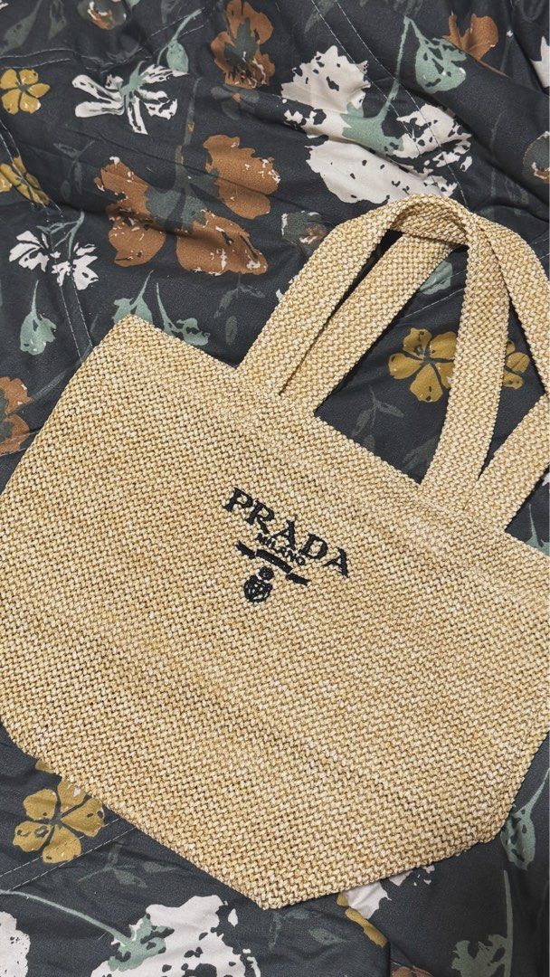 Prada Raffia Handbag - Beige (Category: Luxury Bags & Wallets) located in Plaridel. Submitted by itslouisem (Listing ID 1421528884, Image 3). Description: - Authentic Prada Raffia handbag - Color: Beige - Features the iconic Prada logo - Price: ₱2,500.00 (Original price: ₱3,800.00) - Shipping costs calculated at checkout.