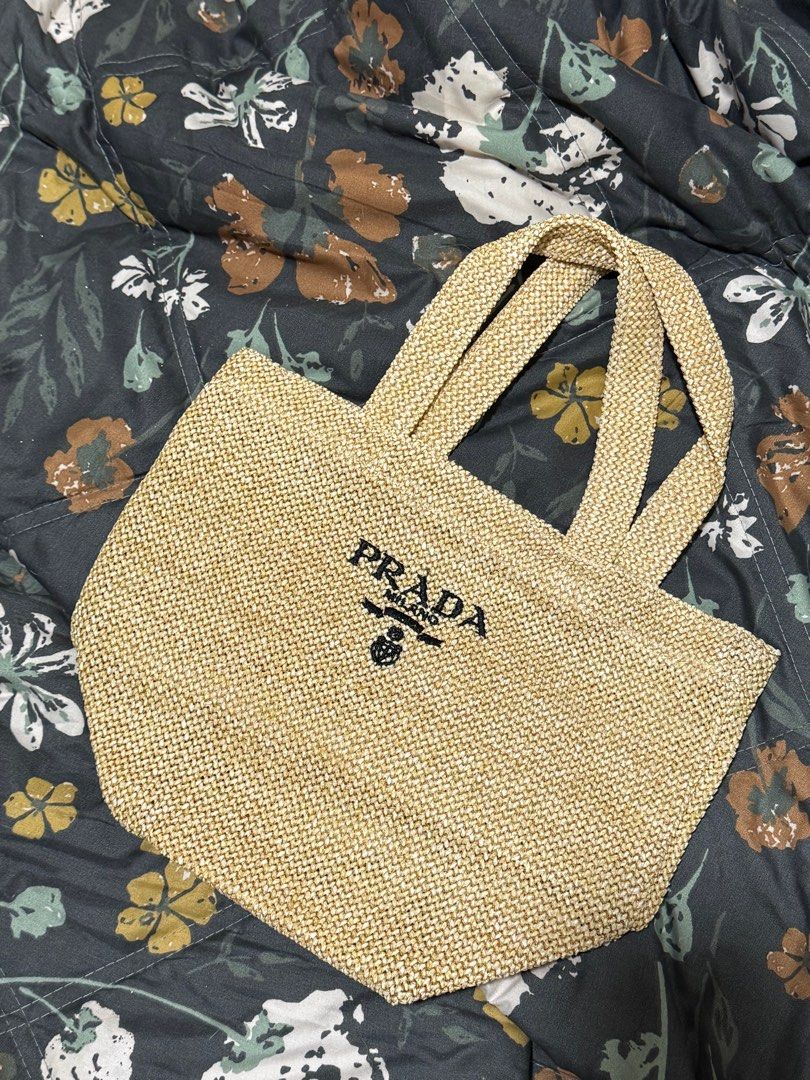 Prada Raffia Handbag - Beige (Category: Luxury Bags & Wallets) located in Plaridel. Submitted by itslouisem (Listing ID 1421528884, Image 2). Description: - Authentic Prada Raffia handbag - Color: Beige - Features the iconic Prada logo - Price: ₱2,500.00 (Original price: ₱3,800.00) - Shipping costs calculated at checkout.