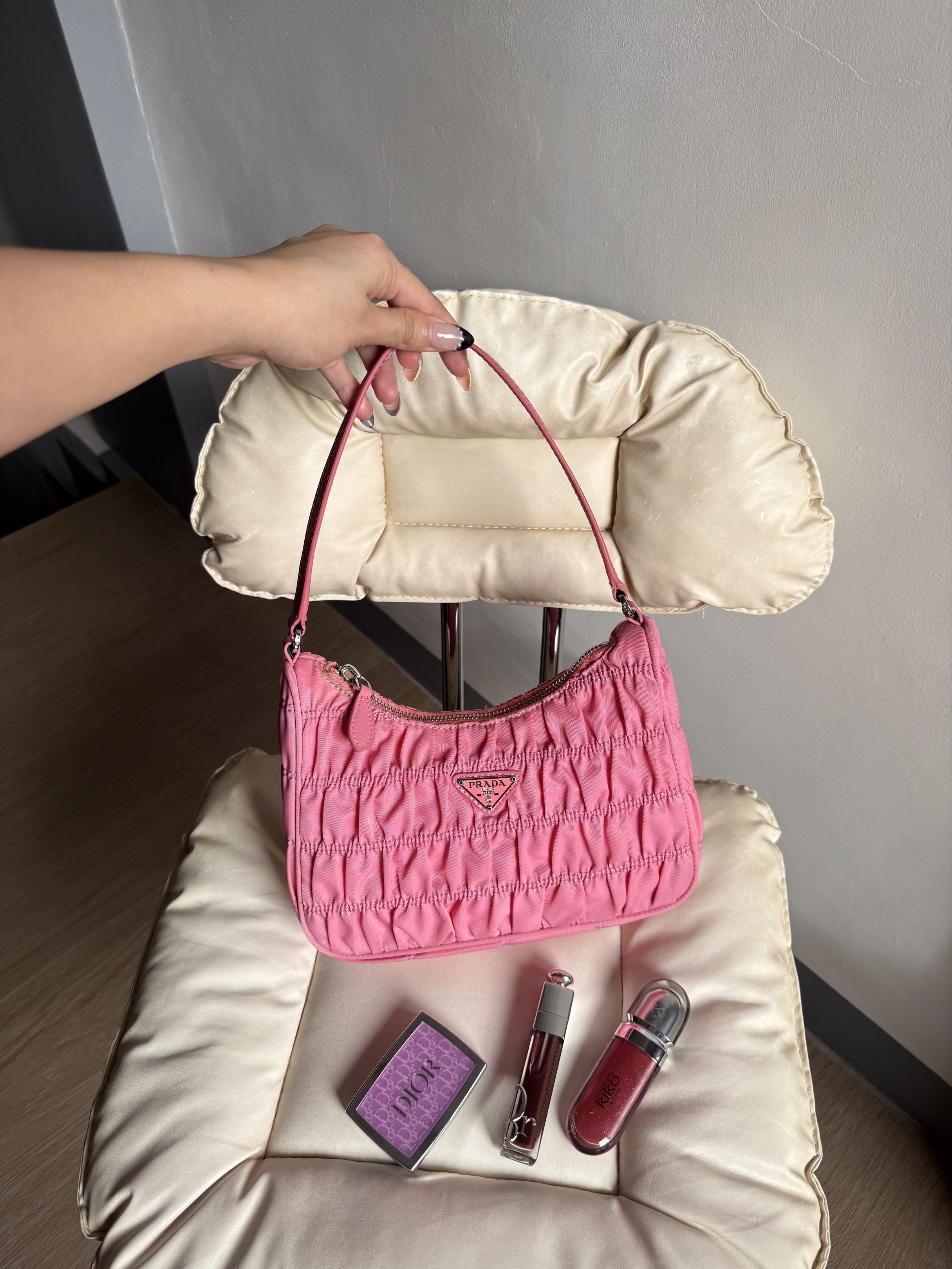 Prada Saffiano Re-Edition in Pink (Category: Luxury Bags & Wallets) located in Bacoor. Submitted by mikaysu (Listing ID 1421413332, Image 1). Description: - Prada shoulder bag - Vibrant pink color - Ruched design - Silver-tone zipper - Prada logo on front and inside - Includes shoulder strap - Clean interior - Tag and code inside - Lampo zip - Japan sourced - NGA.