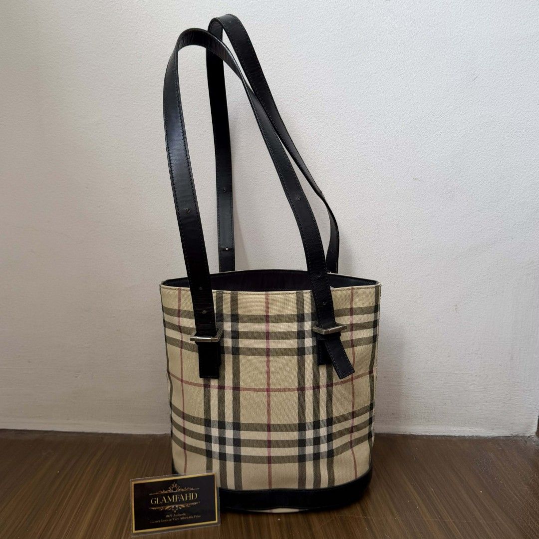 Pre Owned Authentic BURBERRY Checkered Bucket Tote Bag (Category: Luxury Bags & Wallets) located in Paranaque City. Submitted by Glamfahd (Listing ID 1421496789, Image 1). Description: Pre Owned Authentic BURBERRY Bag 9X9.5X5 Inches Inclusion/s: None Condition Well Used condition Marks on exterior Marks on interior Bag is really a great buy! Please manage your expectations as you are buying an authentic second hand item at a fraction of the cost.