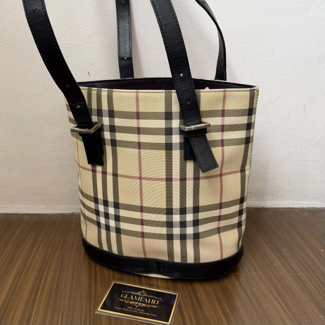 Pre Owned Authentic BURBERRY Checkered Bucket Tote Bag (Category: Luxury Bags & Wallets) located in Paranaque City. Submitted by Glamfahd (Listing ID 1421496789, Image 2). Description: Pre Owned Authentic BURBERRY Bag 9X9.5X5 Inches Inclusion/s: None Condition Well Used condition Marks on exterior Marks on interior Bag is really a great buy! Please manage your expectations as you are buying an authentic second hand item at a fraction of the cost.