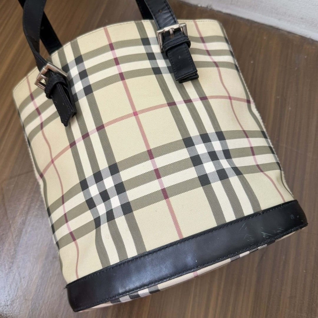 Pre Owned Authentic BURBERRY Checkered Bucket Tote Bag (Category: Luxury Bags & Wallets) located in Paranaque City. Submitted by Glamfahd (Listing ID 1421496789, Image 3). Description: Pre Owned Authentic BURBERRY Bag 9X9.5X5 Inches Inclusion/s: None Condition Well Used condition Marks on exterior Marks on interior Bag is really a great buy! Please manage your expectations as you are buying an authentic second hand item at a fraction of the cost.