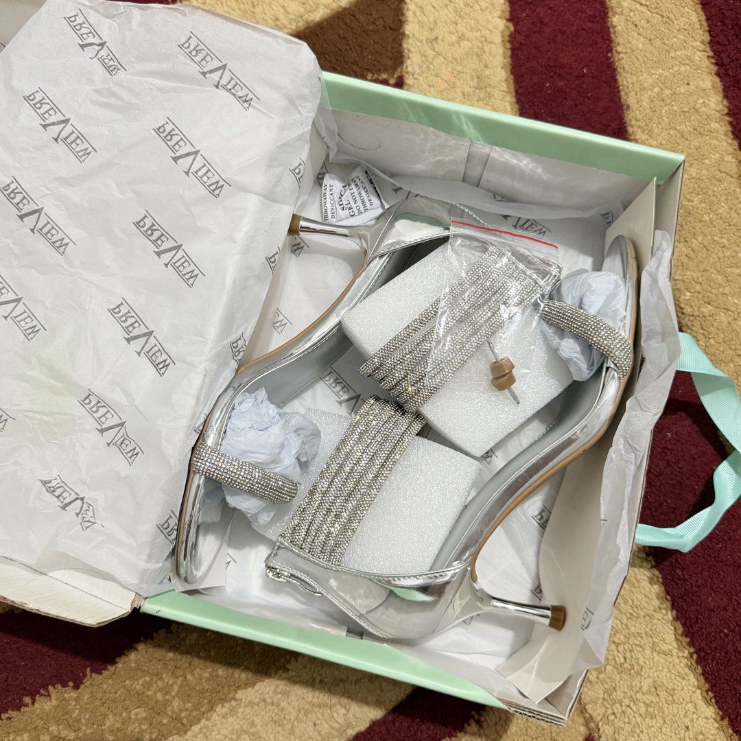 Preview Silver Heels (Category: Heels) located in Manila. Submitted by declutternclutter (Listing ID 1421465380, Image 2). Description: Preview Silver Heels - Good as new ✨ Used only once for a shoot - Condition: 9.8/10 - Comfy to wear - About 2 inches high heels Women’s size 37 (23.5cm - 24 cm feet) - With box and extra heel tips/heel cap Original price is 2,500.