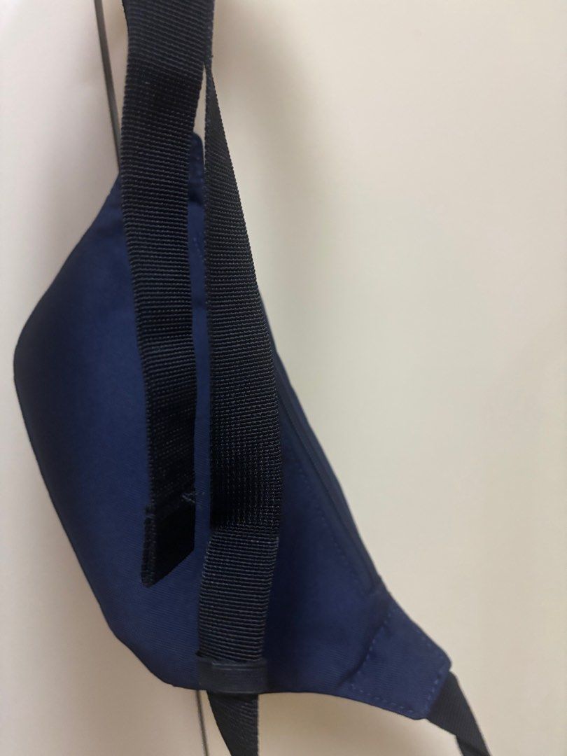 Puma Waist Bag (Category: Belt bags, Clutches and Pouches) located in Manila. Submitted by jrlua (Listing ID 1421565450, Image 3). Description: Navy blue Puma waist bag. Features a main compartment with a zipper closure and an internal pocket. Includes an adjustable strap. The Puma logo is visible on the front. .