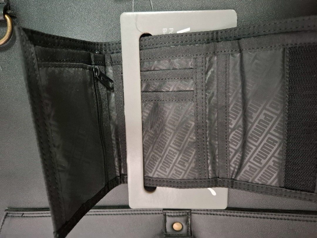 Puma Wallet (Category: Wallets & Card holders) located in Quezon City. Submitted by ejo23 (Listing ID 1421478683, Image 3). Description: Brand new Puma wallet from Taiwan. Trifold and black design. Shipping to be covered by the buyer. Can meetup around Q.C as well..