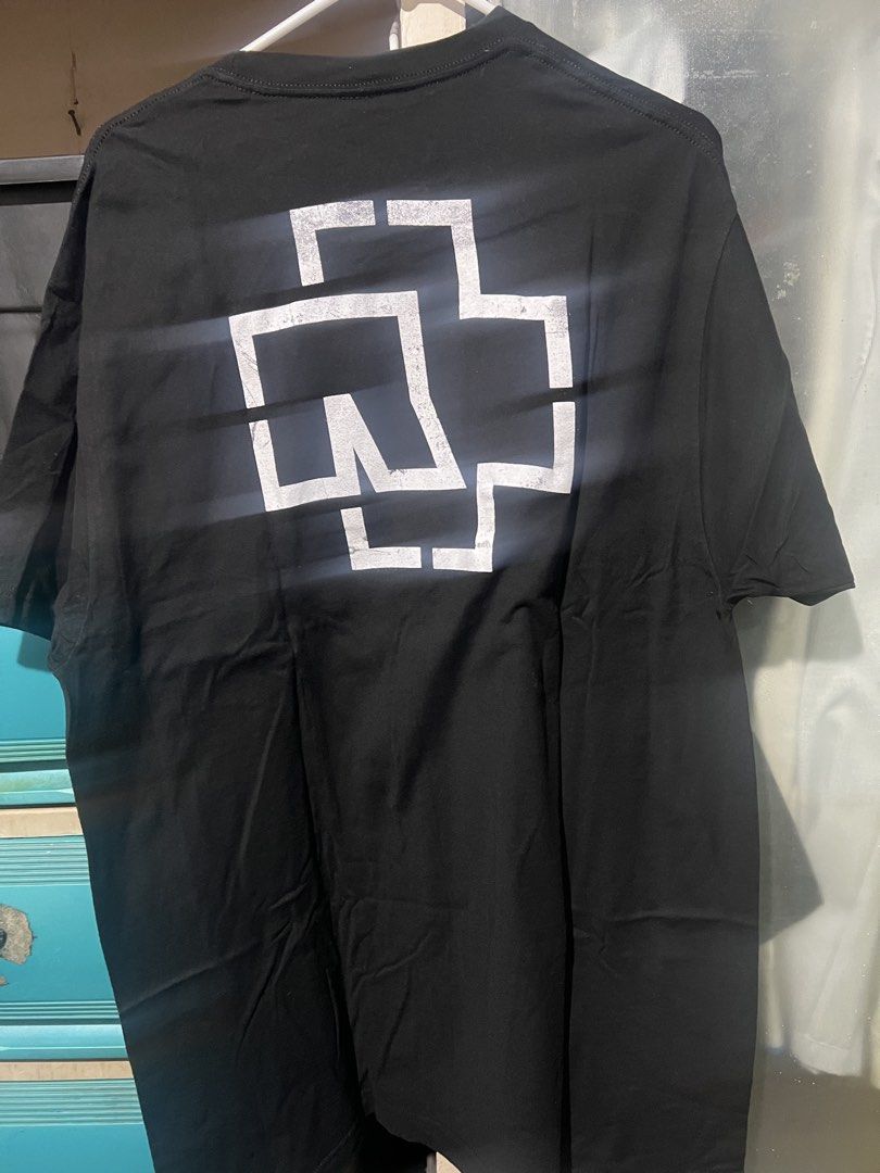 Rammstein Band T-Shirt (Category: Tshirts & Polo Shirts ) located in Manila. Submitted by rarerabbit-fd070e (Listing ID 1421467178, Image 3). Description: - Rammstein band t-shirt - Features band logo on front - Design on the back - Unworn condition - Soft, comfortable material - Perfect for Rammstein fans.