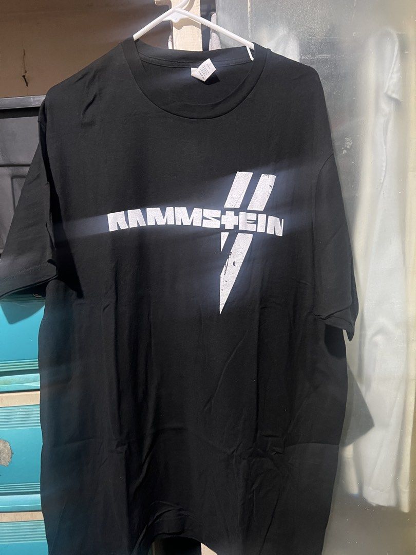 Rammstein Band T-Shirt (Category: Tshirts & Polo Shirts ) located in Manila. Submitted by rarerabbit-fd070e (Listing ID 1421467178, Image 1). Description: - Rammstein band t-shirt - Features band logo on front - Design on the back - Unworn condition - Soft, comfortable material - Perfect for Rammstein fans.