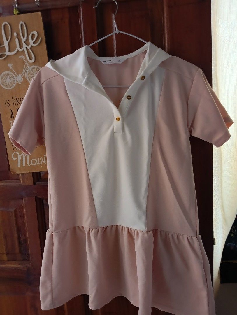 Redtag Dress 7-8 (Category: Babies & Kids Fashion) located in Santa Rosa. Submitted by amiraamara (Listing ID 1421524688, Image 1). Description: - Pink dress with a white collar - Features a hood and short sleeves - Adorned with gold buttons - Ruffled hem detail - Size: 7-8 - Perfect for everyday wear.