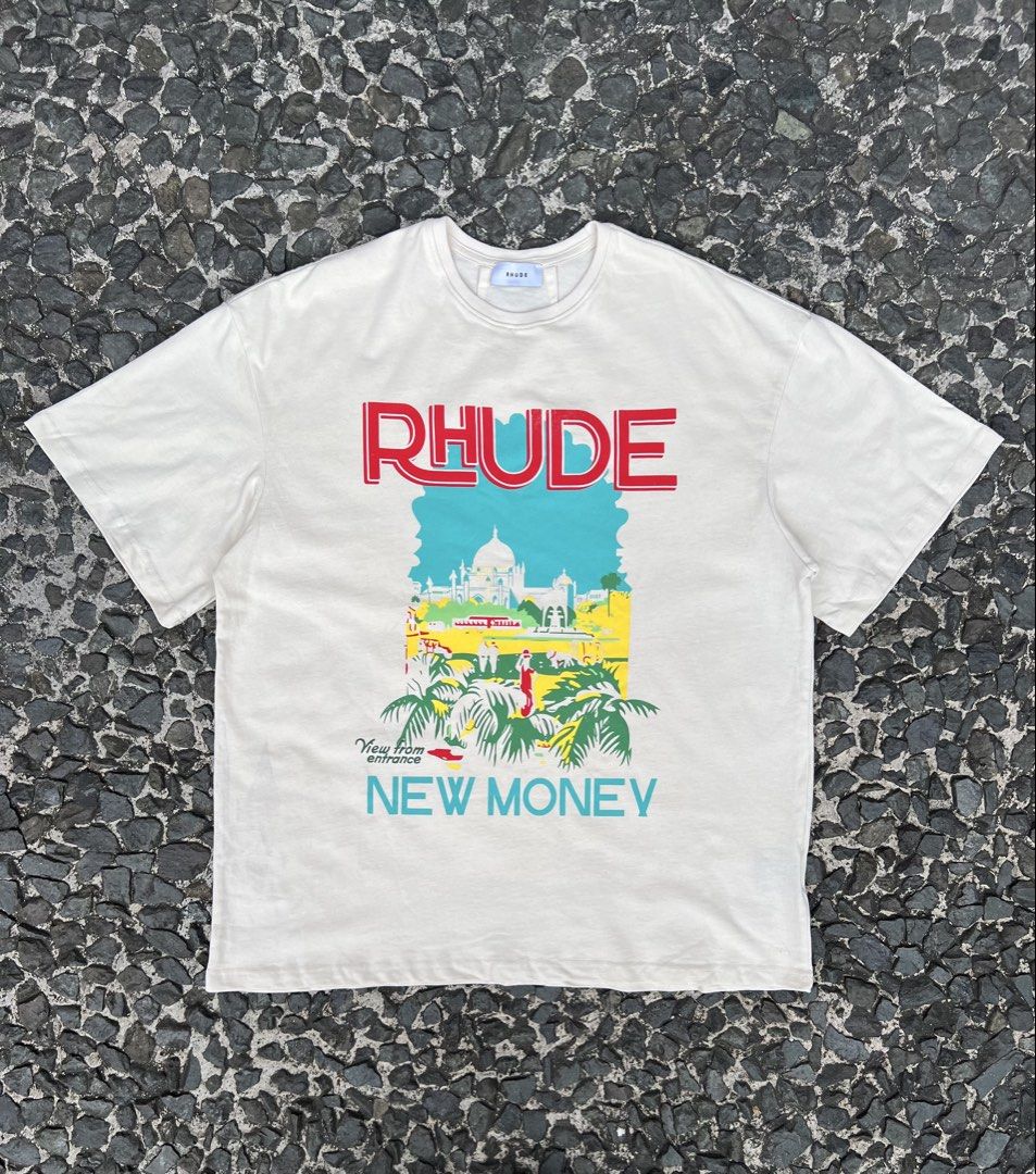 Rhude New Money Graphic Tee (Category: Tshirts & Polo Shirts ) located in Manila. Submitted by -handpick- (Listing ID 1421511591, Image 1). Description: - Rhude "New Money" graphic tee - Color: Cream - Made in USA - Features: Crew neck, short sleeves Size: Large Dimensions : Length: 30 Width: 24 Shoulder : 23 Sleeve : 9 Issue : Check last pic..