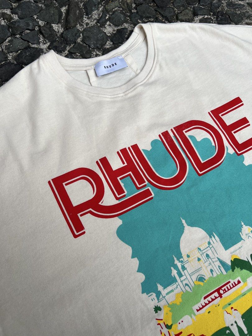 Rhude New Money Graphic Tee (Category: Tshirts & Polo Shirts ) located in Manila. Submitted by -handpick- (Listing ID 1421511591, Image 3). Description: - Rhude "New Money" graphic tee - Color: Cream - Made in USA - Features: Crew neck, short sleeves Size: Large Dimensions : Length: 30 Width: 24 Shoulder : 23 Sleeve : 9 Issue : Check last pic..