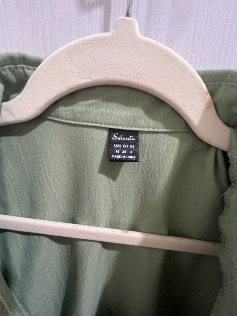 Salanta Green Dress (Category: Dresses) located in Makati City. Submitted by joycesp (Listing ID 1421508542, Image 3). Description: - Salanta green dress - Size M - Collared neckline - Short sleeves - Wrap style with knot detail - Button-down front - Slightly textured fabric.