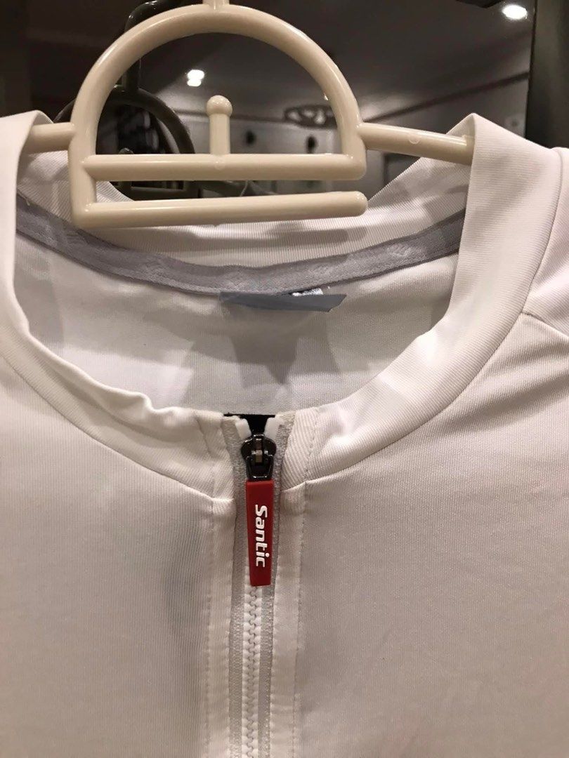 Santic Cycling Jersey - White (Category: Activewear) located in Manila. Submitted by mightydog-2e1a0a (Listing ID 1421536002, Image 2). Description: - White Santic cycling jersey - Full-length zipper - Reflective details on sleeves and back - Santic logo on chest and hem - Streamlined design for performance - Breathable and comfortable.