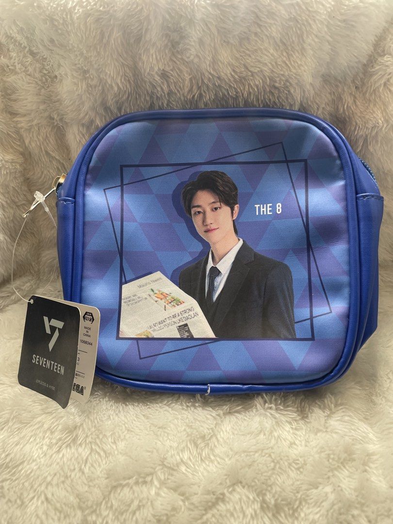 Seventeen The 8 Cosmetic Bag (Category: Purses & Pouches) located in Quezon City. Submitted by end_less_repeat (Listing ID 1421562005, Image 1). Description: - Features a design of The 8 from Seventeen. - Blue exterior. - Seventeen logo on the back. - Zipper closure. - Includes a tag. - Blue interior. - Licensed product..