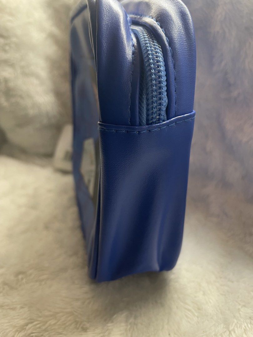 Seventeen The 8 Cosmetic Bag (Category: Purses & Pouches) located in Quezon City. Submitted by end_less_repeat (Listing ID 1421562005, Image 3). Description: - Features a design of The 8 from Seventeen. - Blue exterior. - Seventeen logo on the back. - Zipper closure. - Includes a tag. - Blue interior. - Licensed product..