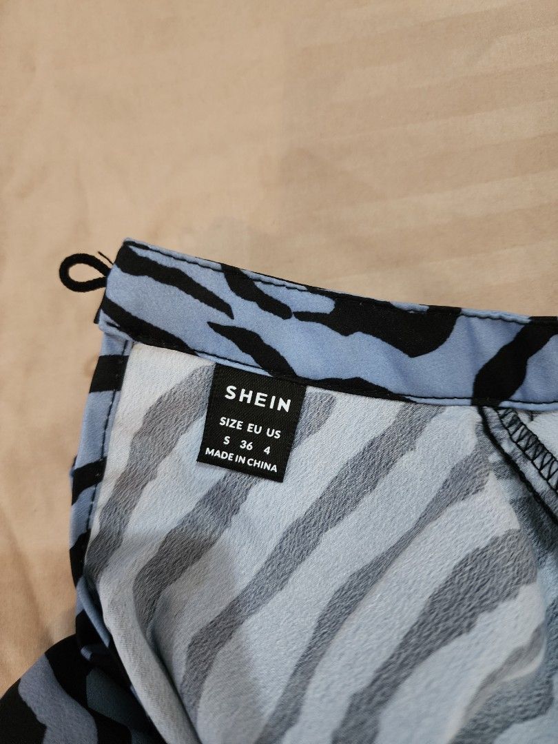 Shein Zebra Print Top - Size S (Category: Blouses) located in Cagayan de Oro. Submitted by declutter97 (Listing ID 1421505456, Image 3). Description: - Shein zebra print top - Size: Small (S) - Design: Round neckline, short sleeves - Detail: Keyhole back - Fabric: Lightweight - Used Once.
