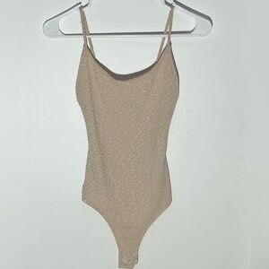 Shimmery beige bodysuit (Category: Sleeveless) located in Manila. Submitted by brandedclothes (Listing ID 1421501520, Image 1). Description: .