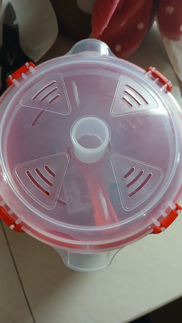 Sistema Microwave Rice Cooker (Category: Cookers) located in Imus. Submitted by dahdahlicious (Listing ID 1421553839, Image 2). Description: Sistema microwave rice cooker. Designed to cook rice, quinoa, and other grains in the microwave. Features a pressure chamber plate, locking clips, and a steam vent. BPA-free and dishwasher-safe. Includes a rice spoon and instructions..