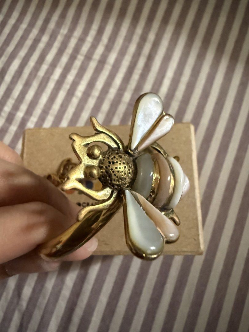 Strozzi Bee Bracelet (Category: Bracelets) located in Caloocan City. Submitted by hellodeco (Listing ID 1421560132, Image 3). Description: Strozzi handcrafted bracelet/bangle Features a unique bee charm Comes with original box Brand new. Bought 2025. Original price was P3500. RFS: impulse purchase at Katutubo. .