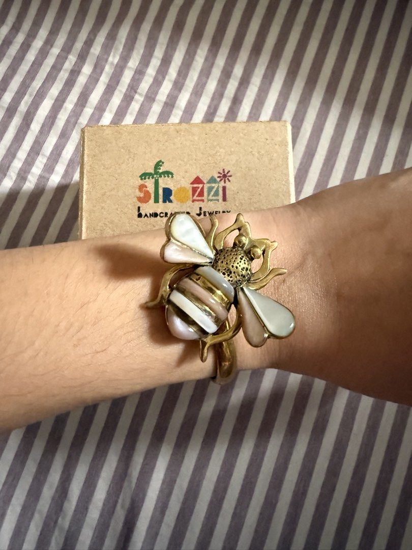 Strozzi Bee Bracelet (Category: Bracelets) located in Caloocan City. Submitted by hellodeco (Listing ID 1421560132, Image 1). Description: Strozzi handcrafted bracelet/bangle Features a unique bee charm Comes with original box Brand new. Bought 2025. Original price was P3500. RFS: impulse purchase at Katutubo. .