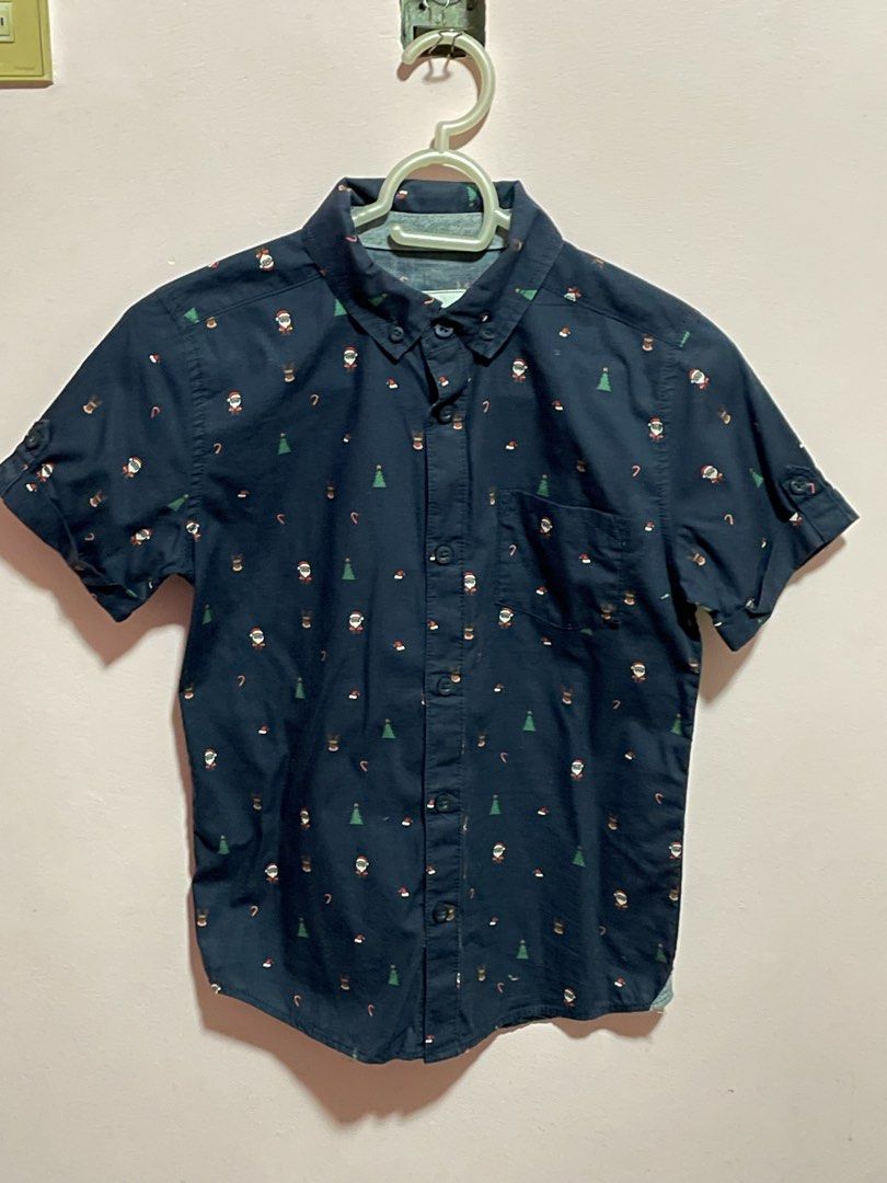 Target Kids Christmas Polo (Category: Babies & Kids Fashion) located in Infanta. Submitted by chokimon (Listing ID 1421602094, Image 1). Description: Brand: Target - Christmas-themed short-sleeved shirt - Features Santa, reindeer, and candy cane prints - Navy blue color - Button-down front - Collared neckline - Chest pocket - Size 8 (fits 6 to 8y) used twice during school Christmas party and Christmas eve.