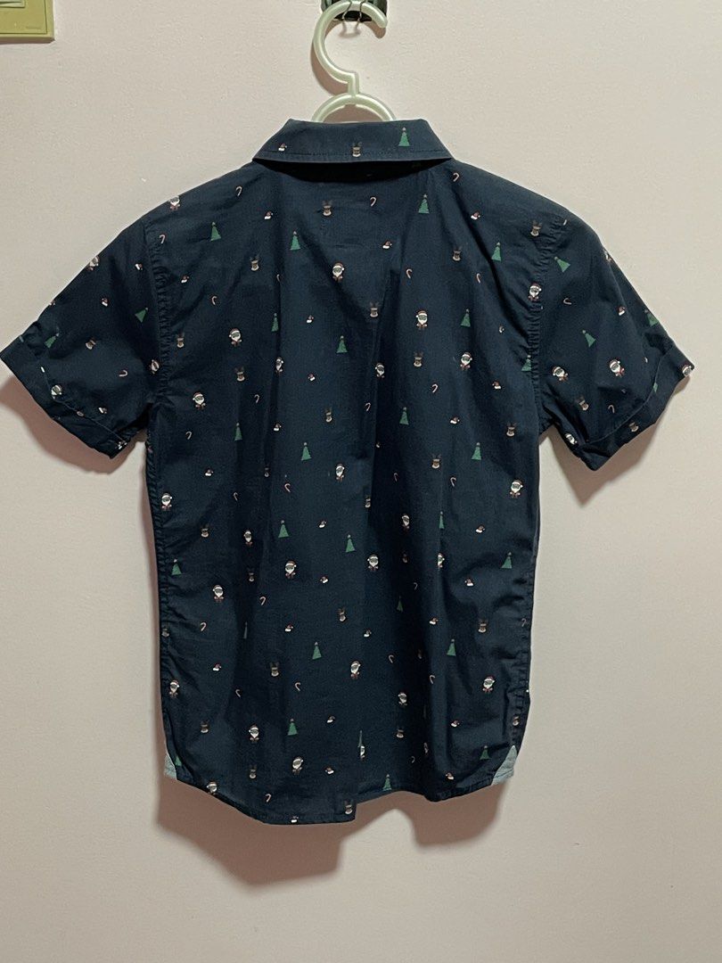 Target Kids Christmas Polo (Category: Babies & Kids Fashion) located in Infanta. Submitted by chokimon (Listing ID 1421602094, Image 2). Description: Brand: Target - Christmas-themed short-sleeved shirt - Features Santa, reindeer, and candy cane prints - Navy blue color - Button-down front - Collared neckline - Chest pocket - Size 8 (fits 6 to 8y) used twice during school Christmas party and Christmas eve.