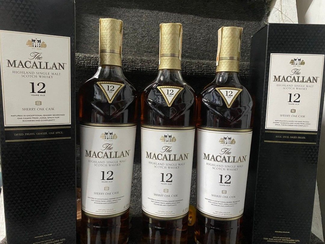 The Macallan 12 Year Old Sherry Oak (Category: Beverages) located in Manila. Submitted by bigfish1990 (Listing ID 1421544568, Image 1). Description: - The Macallan 12 Year Old Sherry Oak Highland Single Malt Scotch Whisky. - Three bottles available. - Each bottle comes in its original box. - Features a gold-colored cap. - Authentic label displaying brand, age, and Sherry Oak details..