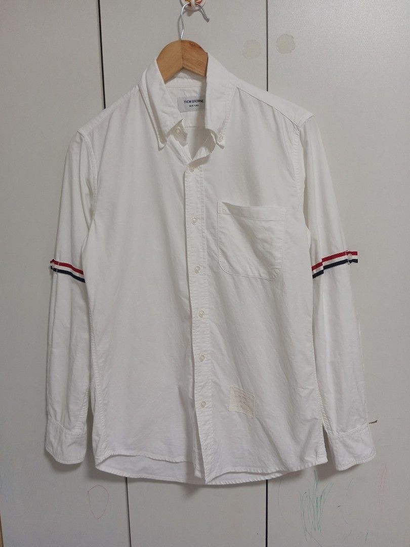 Thom Browne White Long sleeve shirts bundle (Category: Luxury Apparel) located in Taguig. Submitted by nextflip (Listing ID 1421561190, Image 2). Description: White Thom Browne shirt with signature stripe detailing on the sleeves. only 1 available for 3880+sf or best offer see other listings for more details.
