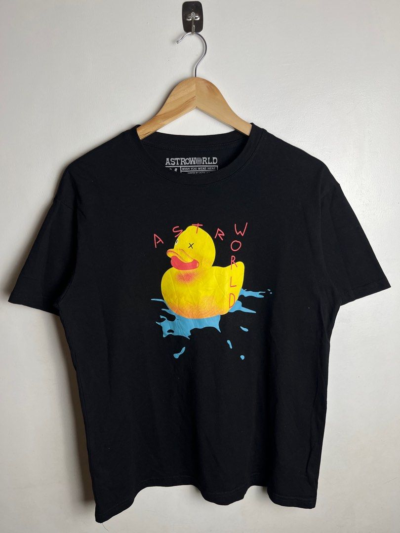 Travis Scott Astroworld Wish You Were Here Tee (Category: Tshirts & Polo Shirts ) located in Munoz. Submitted by purvyr (Listing ID 1421571190, Image 2). Description: Black Astroworld t-shirt featuring a duck graphic on the front and "Wish You Were Here" design on the back. It is a medium-sized shirt with a width of 20.5 inches and a length of 26.5 inches. The shirt is curated by Cactus Jack and made of 100% cotton. It has a crew neck and short s