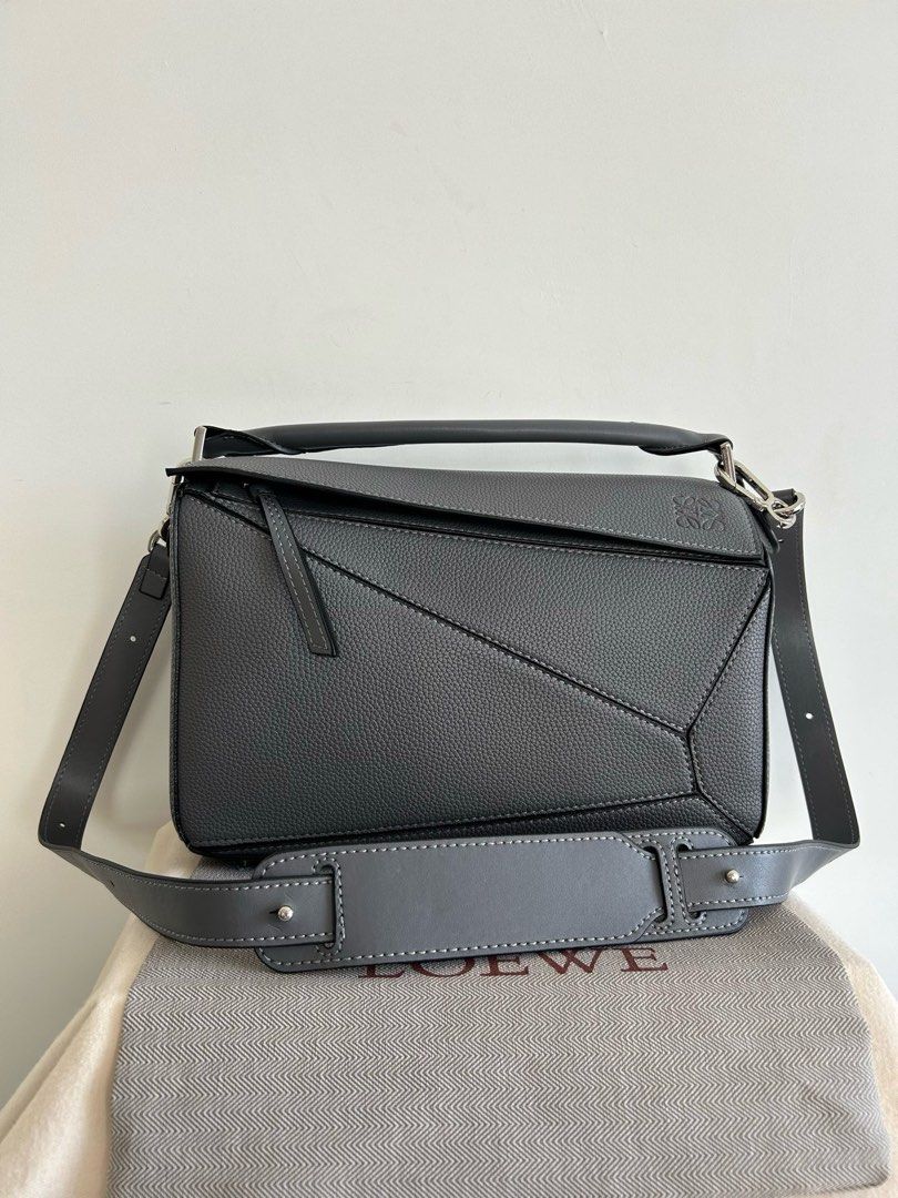 Vintage Loewe Puzzle Bag in Grey (Category: Luxury Bags & Wallets) located in Manila. Submitted by pursonalshopper (Listing ID 1421610139, Image 1). Description: Loewe Small Puzzle Bag 100% Authentic 💯 Pre-loved Bought from Japan COMPLETE INCLUSIONS: ✅Dustbag ✅Box & paperbag ✅Extra Loewe Sling strap ✅Authenticity card + entrupy certificate Dimensions: approximately 24 cm (width) x 16.5 cm (height) x 10.5 cm (depth), or about 9.4 x 6.5 x 4.1 inch