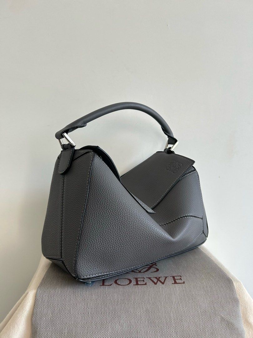 Vintage Loewe Puzzle Bag in Grey (Category: Luxury Bags & Wallets) located in Manila. Submitted by pursonalshopper (Listing ID 1421610139, Image 3). Description: Loewe Small Puzzle Bag 100% Authentic 💯 Pre-loved Bought from Japan COMPLETE INCLUSIONS: ✅Dustbag ✅Box & paperbag ✅Extra Loewe Sling strap ✅Authenticity card + entrupy certificate Dimensions: approximately 24 cm (width) x 16.5 cm (height) x 10.5 cm (depth), or about 9.4 x 6.5 x 4.1 inch
