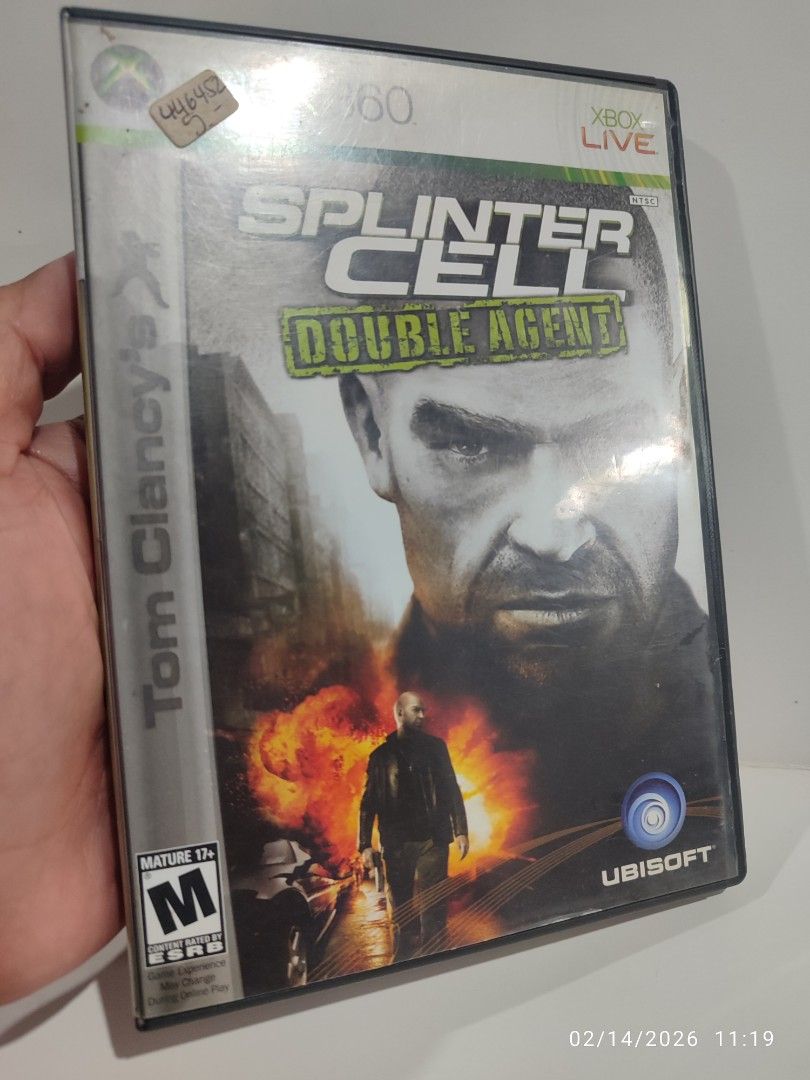 XBOX 360 - Splinter Cell: Double Agent (PRE-OWNED) "OPEN REGION" (Category: Xbox) located in Mendez-Nunez. Submitted by sf2_gameshop (Listing ID 1421477105, Image 2). Description: PLEASE READ The disc is not region locked and plays on any XBOX 360. NTSC/J - √ (Yes) NTSC - √ (Yes) PAL - √ (Yes) CONDITION: Pre-owned item. The disc has scratches (see photos) but works perfectly without any problem. It comes with a game manual. GENRE: Action-adventur