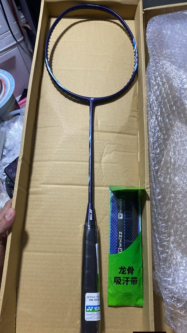 Yonex Badminton Racket (Category: Racket and Ball Sports) located in Taguig. Submitted by jerafelsan87737 (Listing ID 1421550883, Image 1). Description: - Brand new Yonex ROX LITE 271 badminton racket. - Comes with a grip. - Still in its original packaging. - Features a stylish blue and white design..